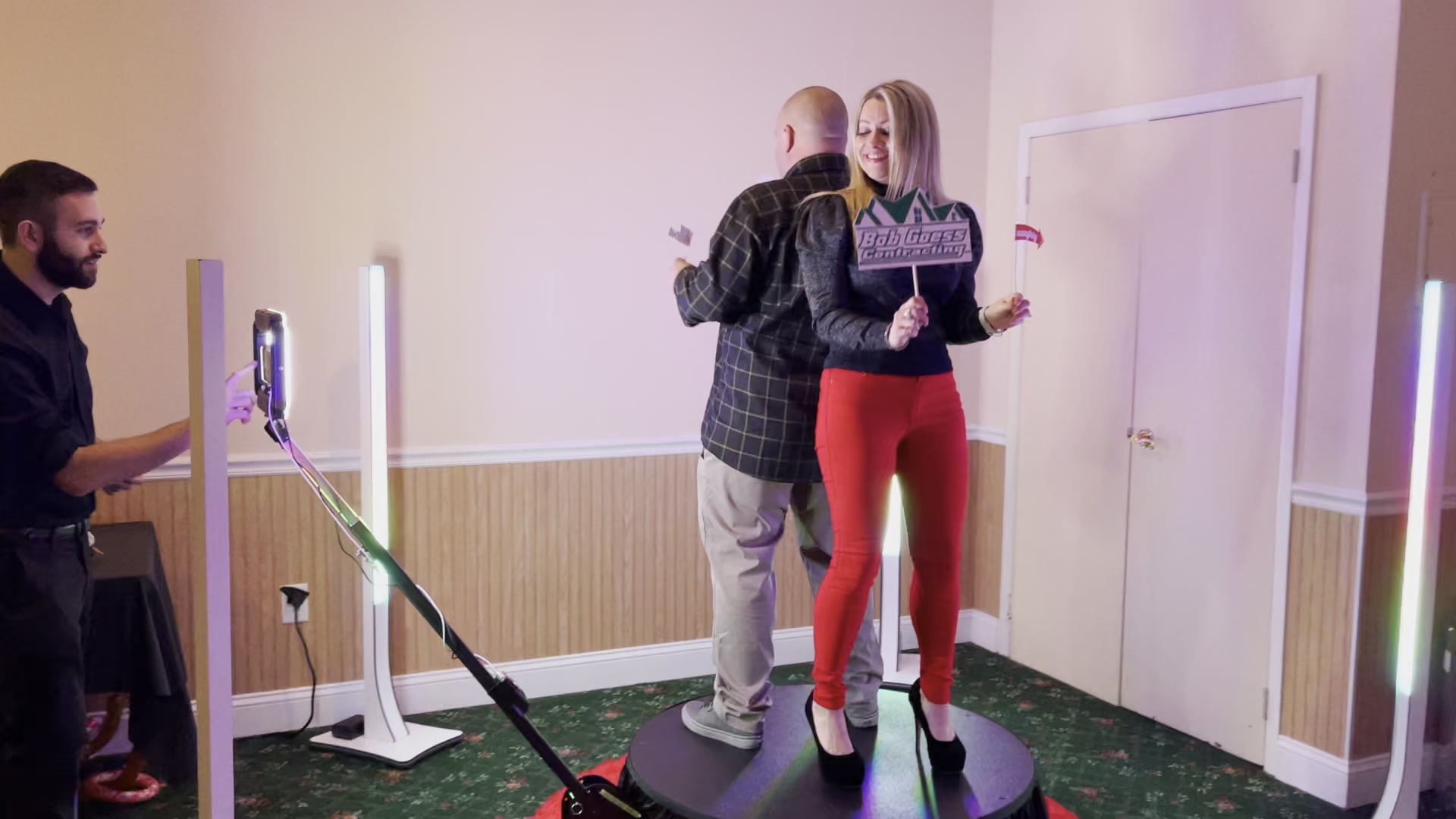 Guests filming on a 360 video booth platform