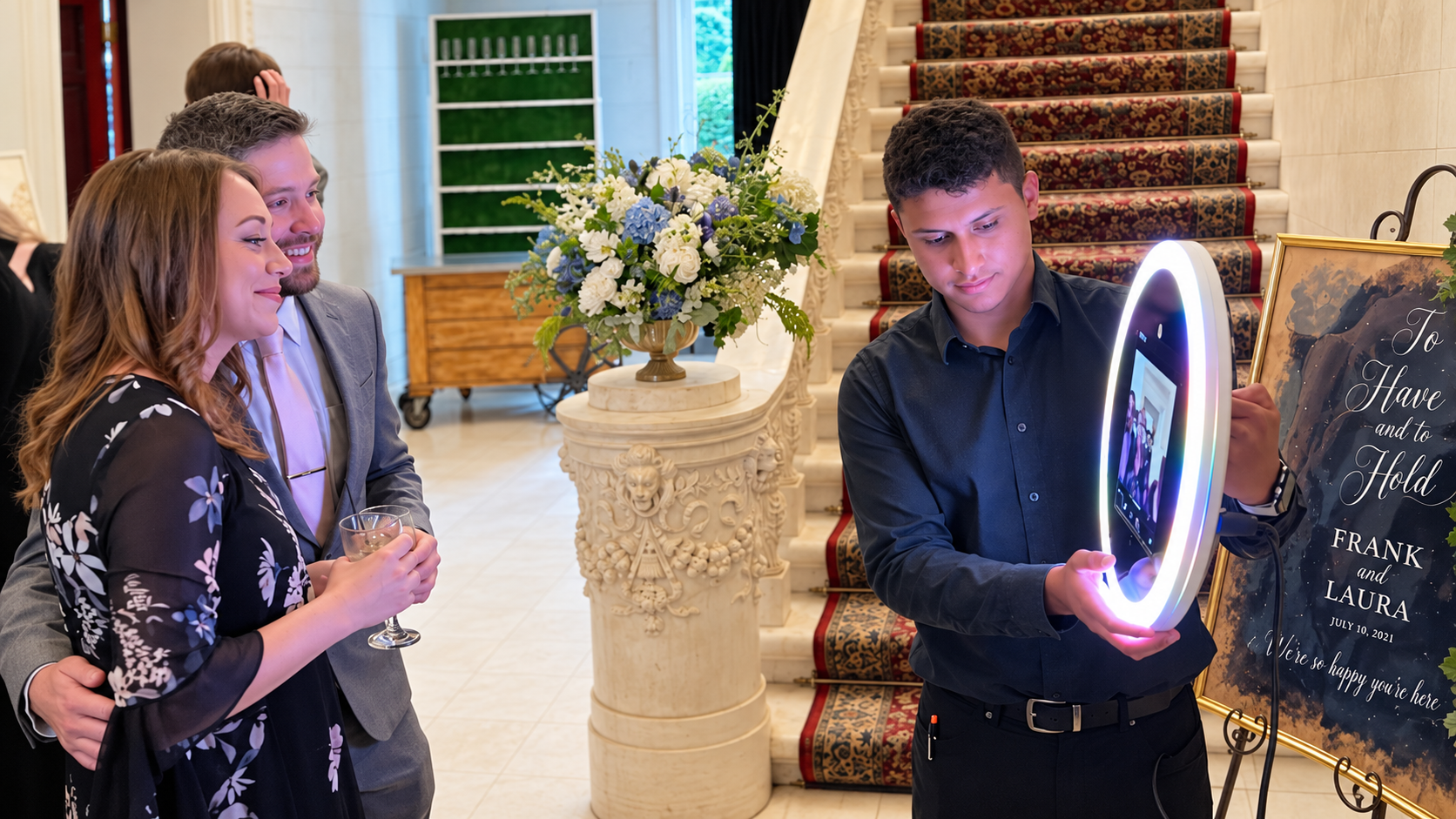 Roaming photo booth operator photographing guests with a ring light