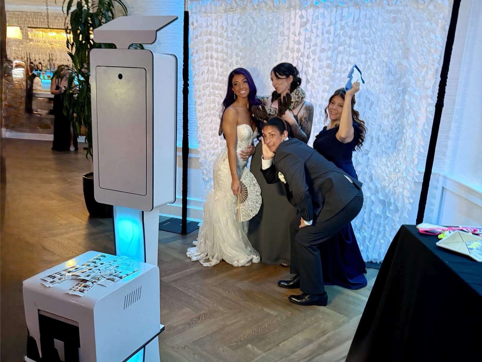 Guests posing at an open-air photo booth