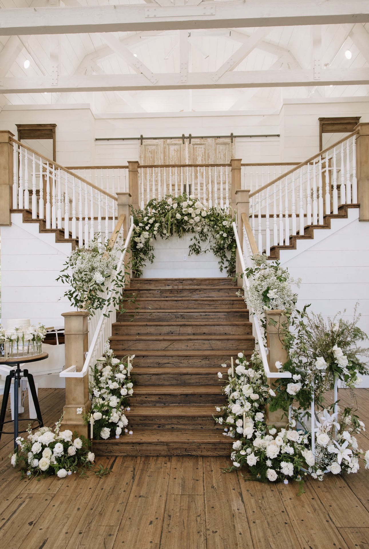 Grand staircase lined with ivory florals