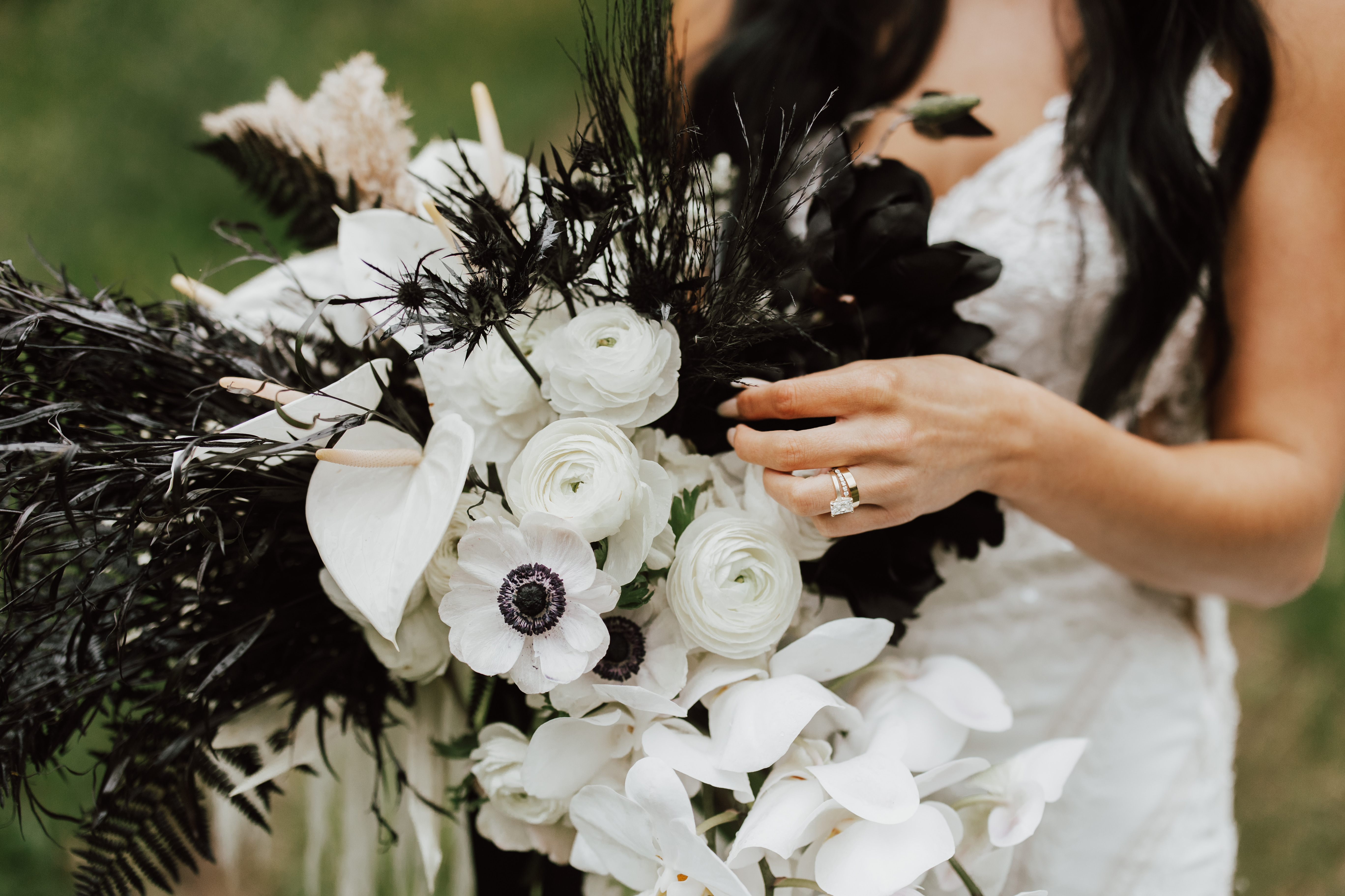 Close-up of anemones and dried palms in the bridal bouquet