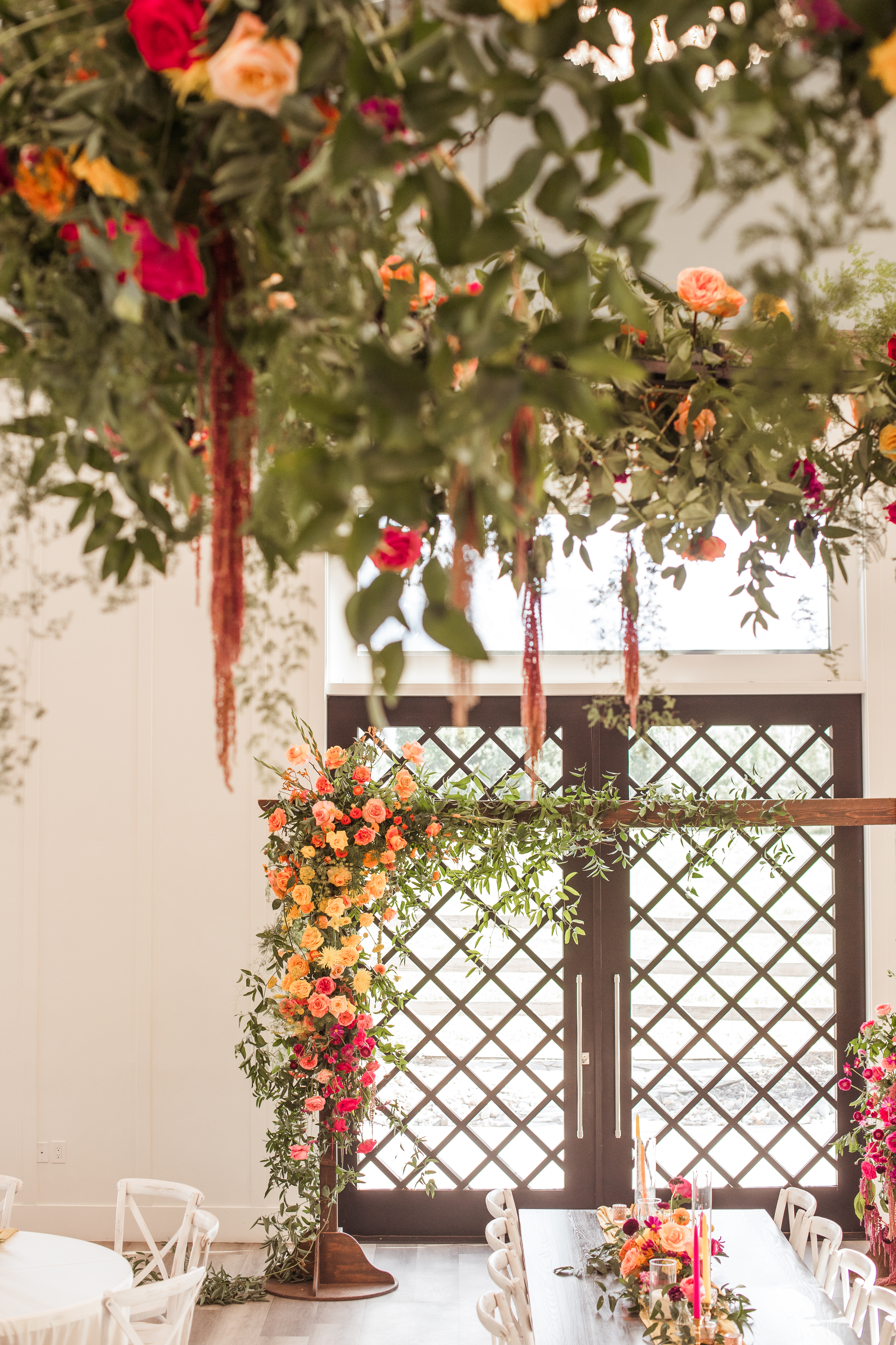 Hanging florals framing a lattice doorway