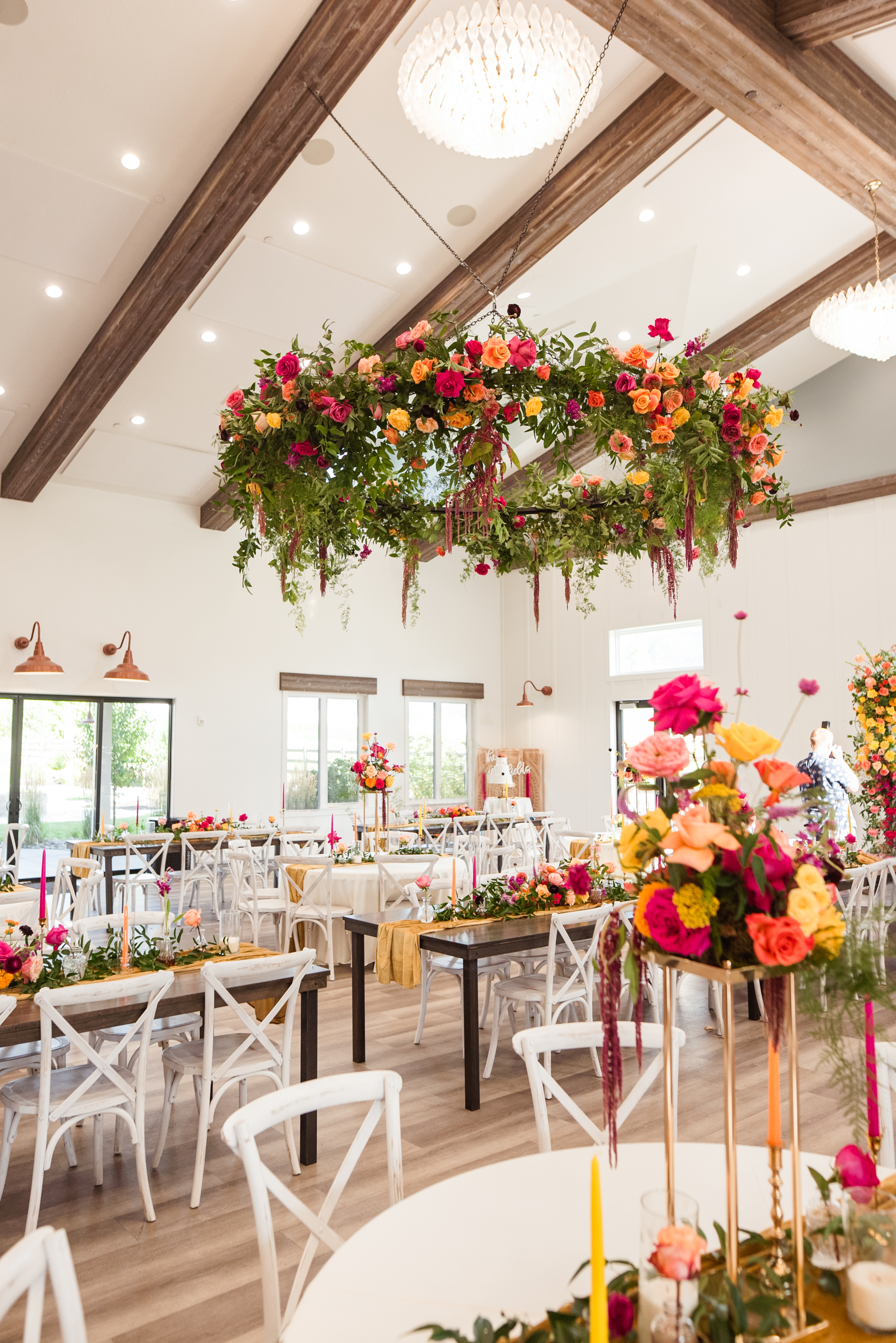 Suspended floral chandelier over the reception tables