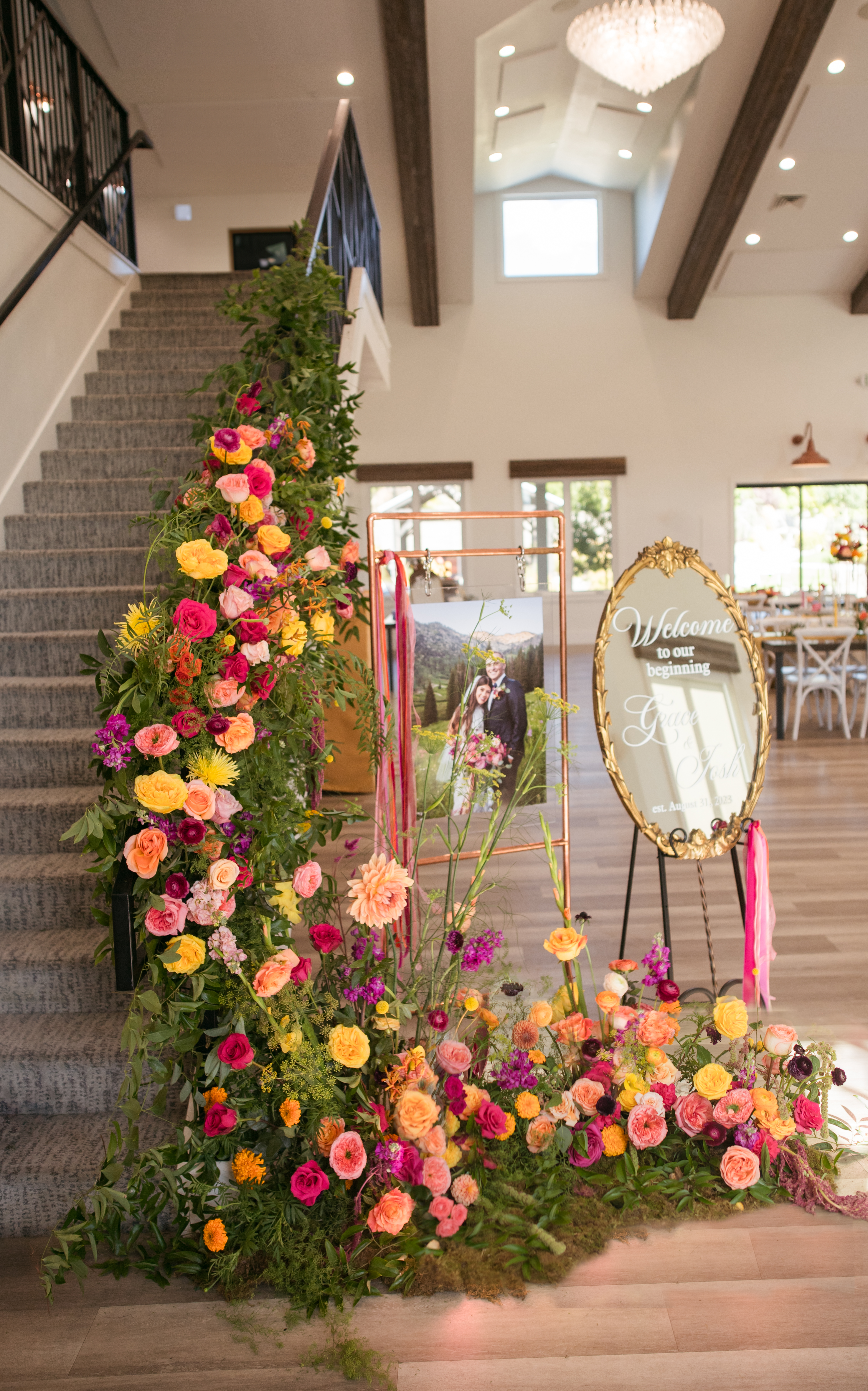 Staircase lined with cascading marigold and pink florals