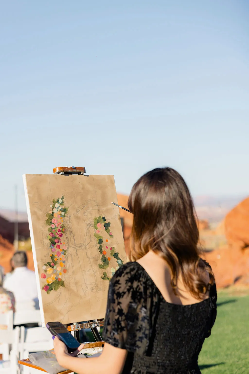 Live event painter capturing a red rock wedding ceremony