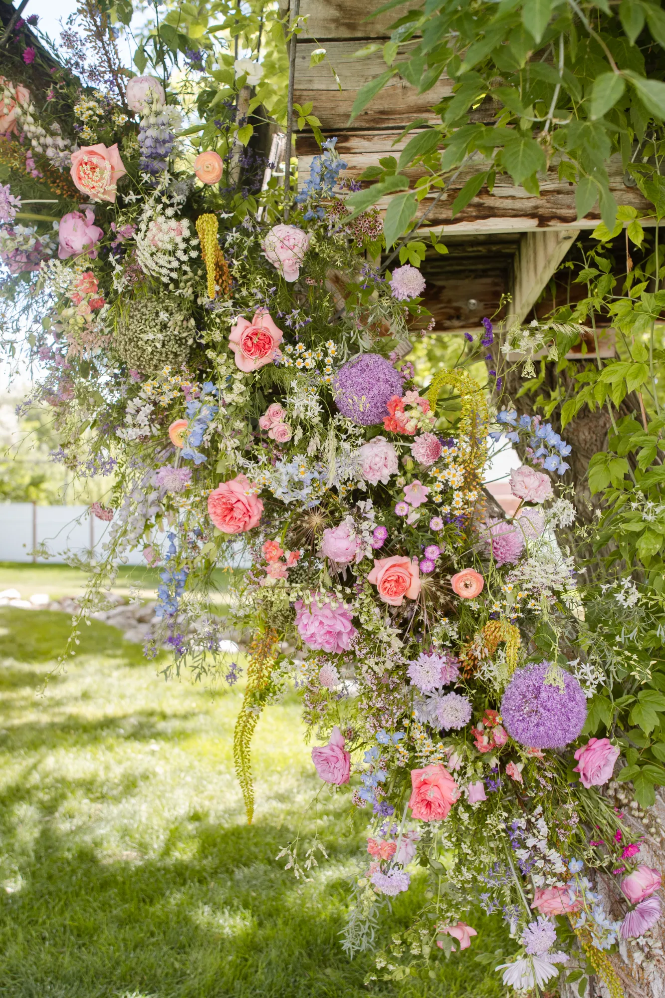 Floral installation climbing a tree trunk