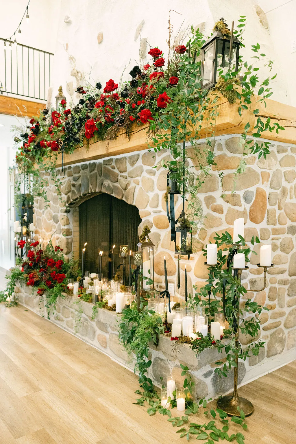 Fireplace mantel installation with red roses and candles