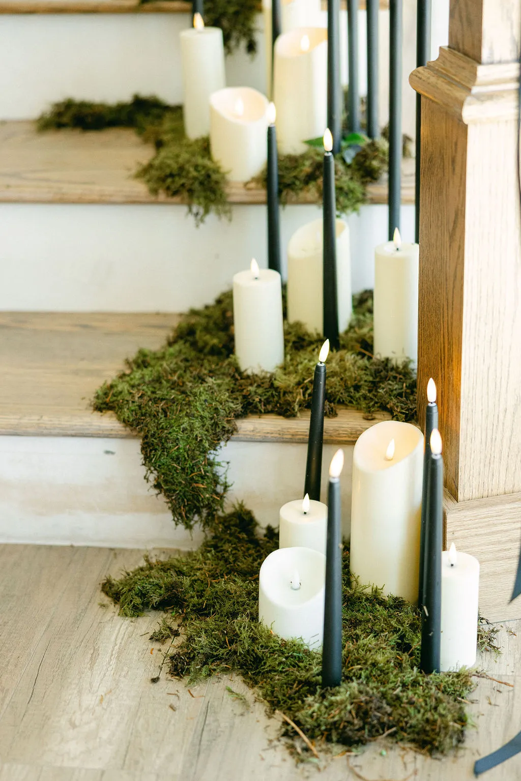 Pillar candles nestled in moss