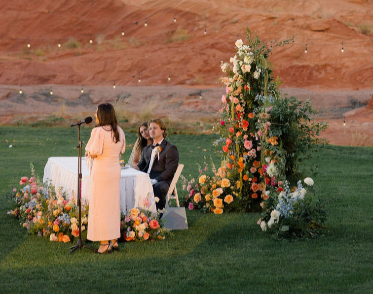 Sweetheart table and floral tower against red rock