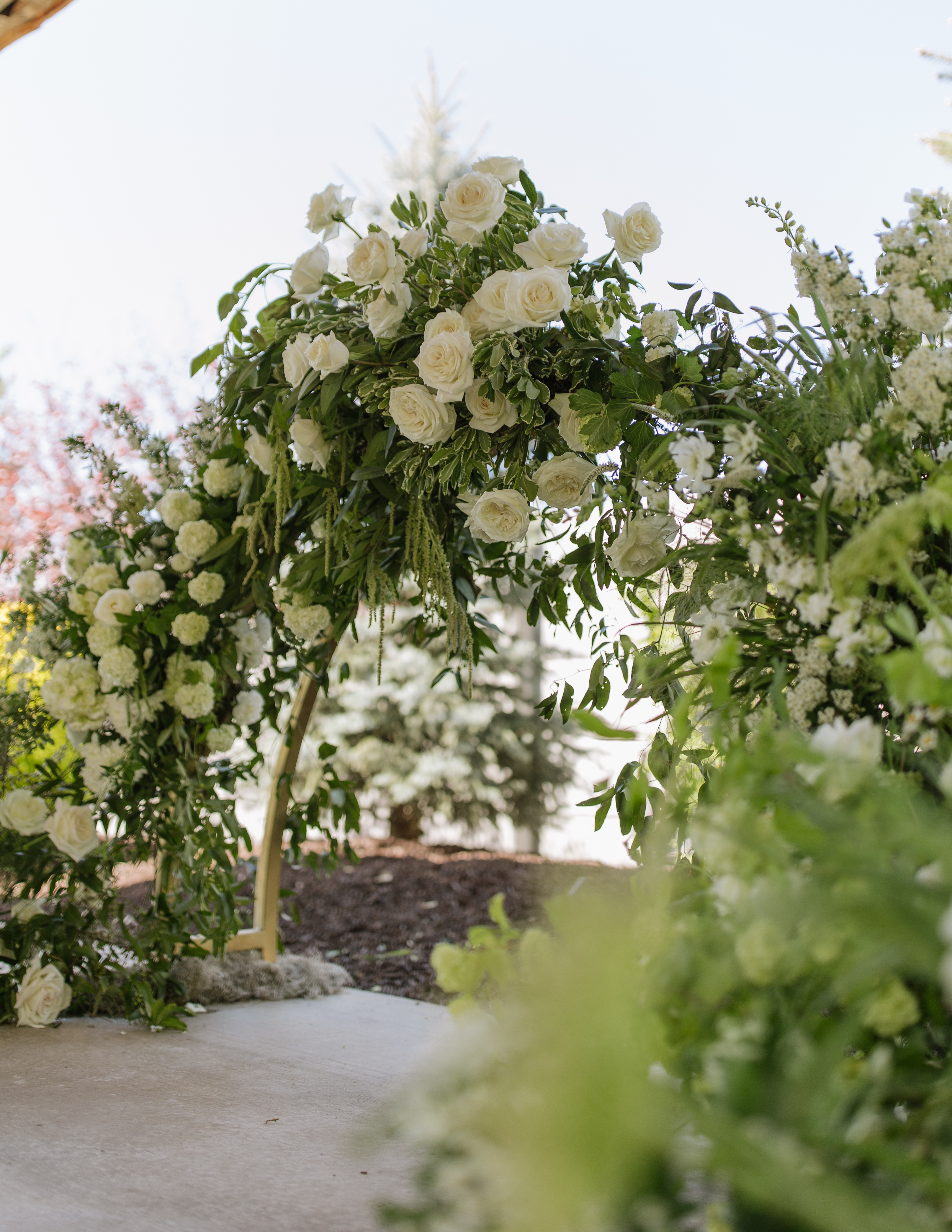 Lush white and green garden arch