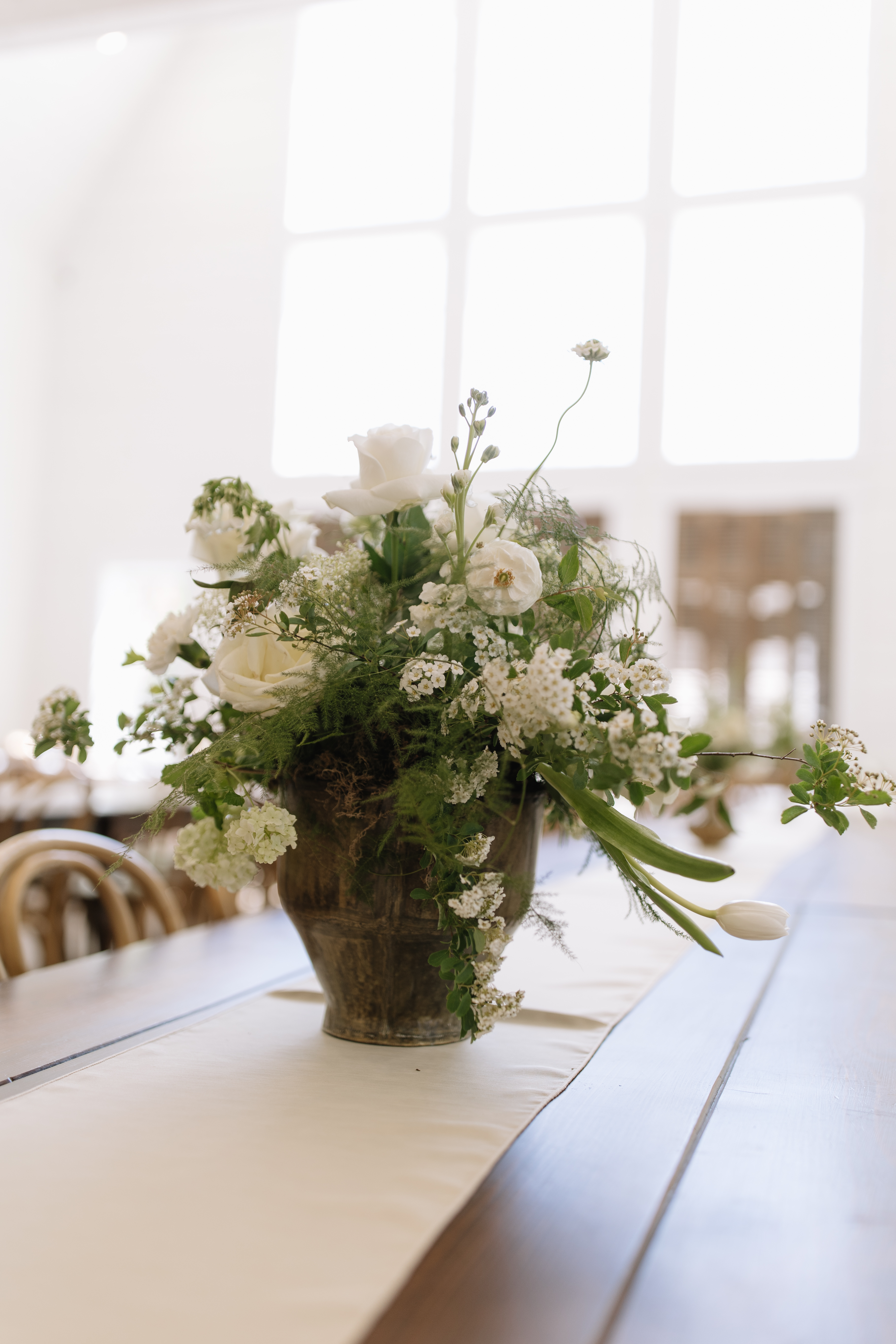 Ivory and green centerpiece on a reception table