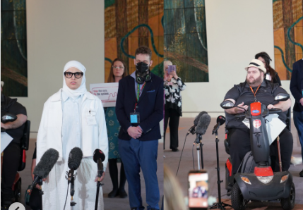 Loma Naser with fellow advocates and microphones at a press conference