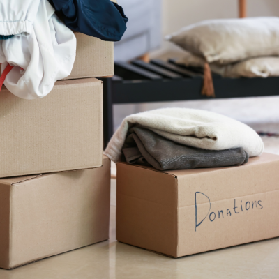 Image of a cardboard box with the word Donations written on it. 