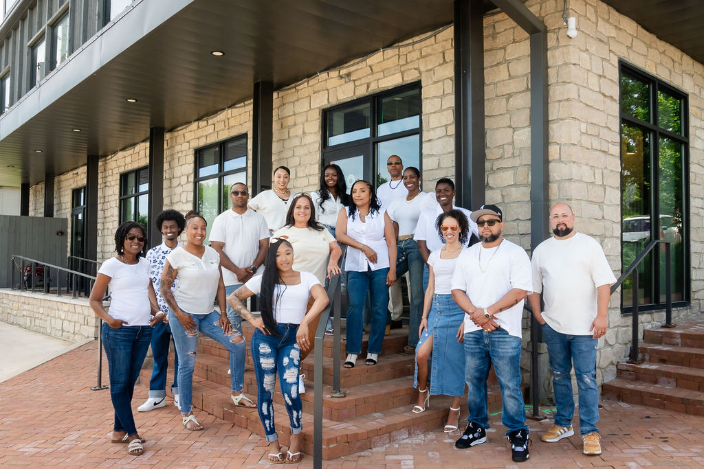 The full Take A Look Real Estate Brokers team standing together