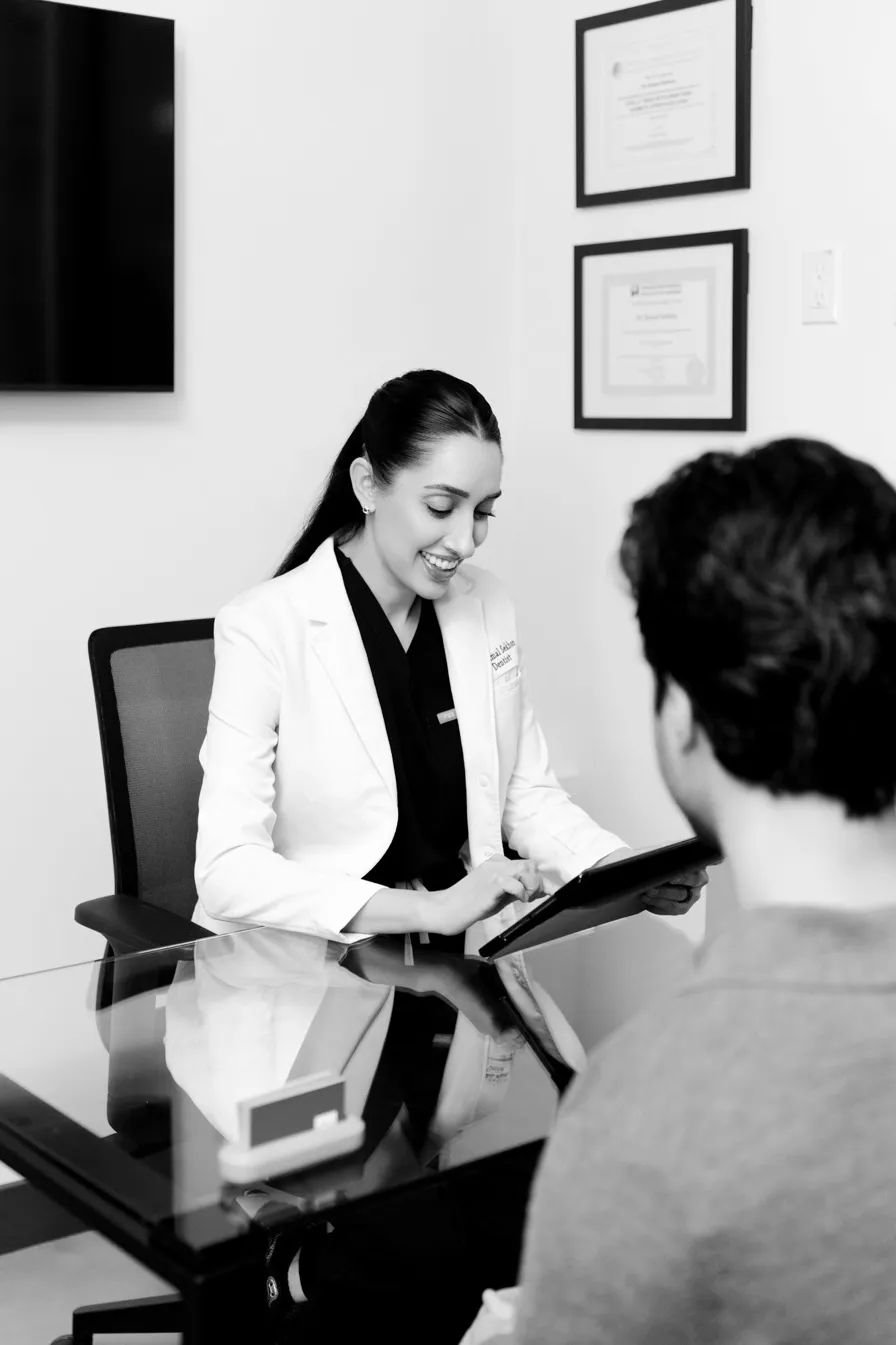 Dr. Kamal Sekhon consulting with patient