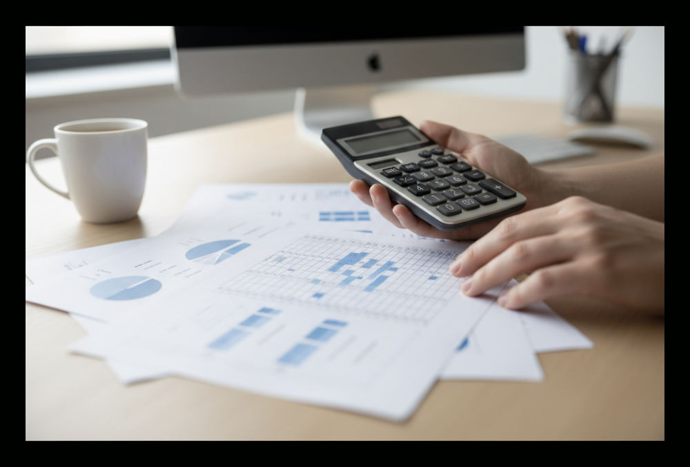 Business professional reviewing detailed spreadsheet comparing CRM subscription features across multiple pricing tiers
