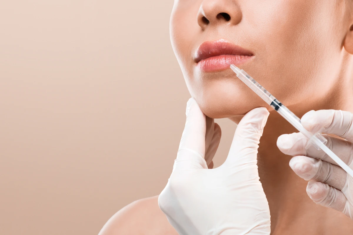 Woman with smooth skin illustrating facial rejuvenation with dermal fillers
