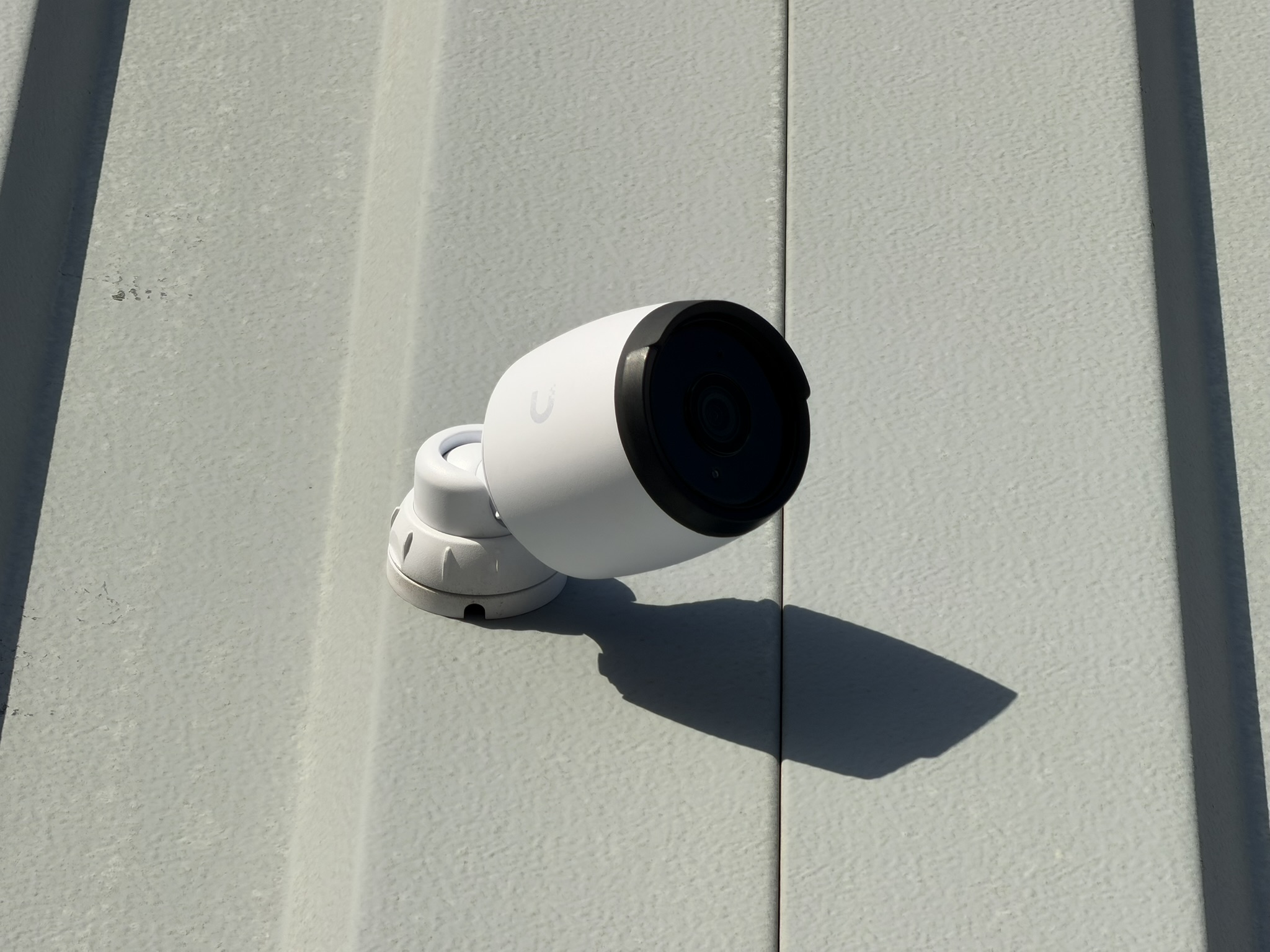 Exterior mounted security camera on commercial building
