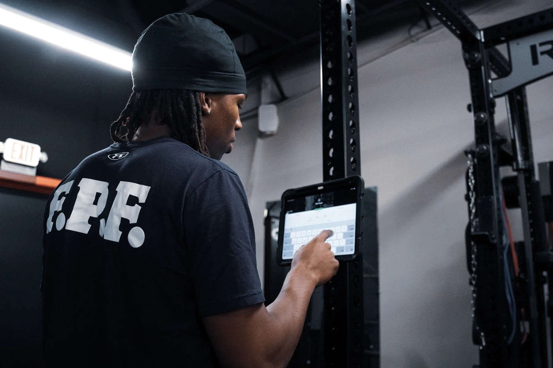 An OPC athlete reviewing a training program