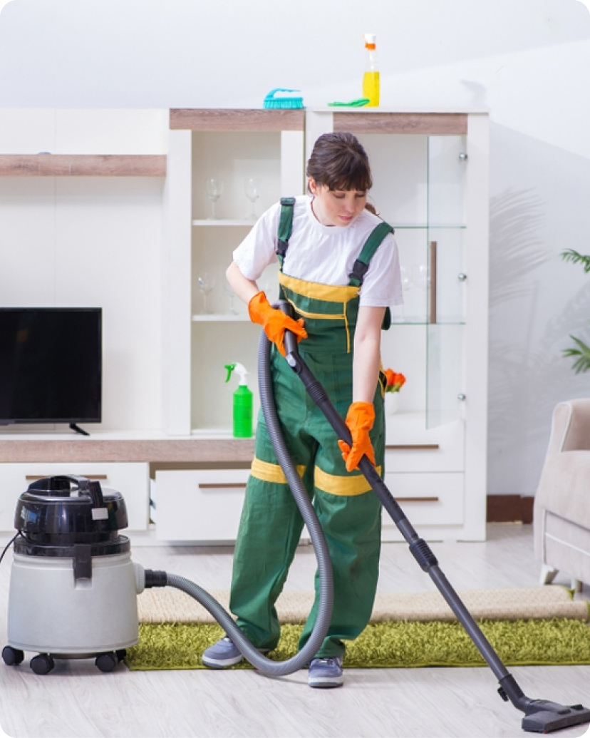 Professional house cleaning team cleaning a bright living room in Cincinnati, OH