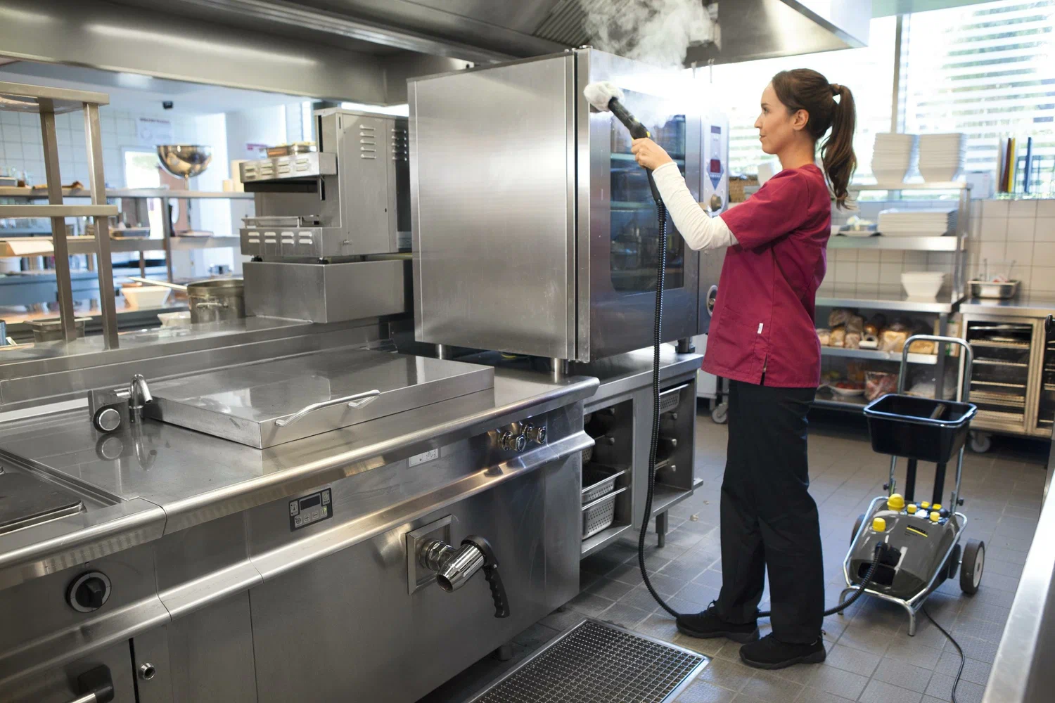 Professional restaurant cleaning team maintaining a kitchen and dining area in Cincinnati, OH