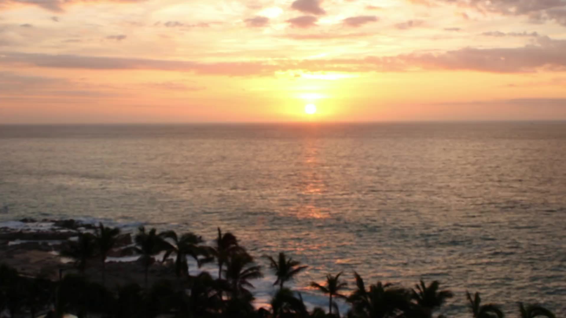 Sunset over the ocean at a Health Experts Alliance retreat in Cabo