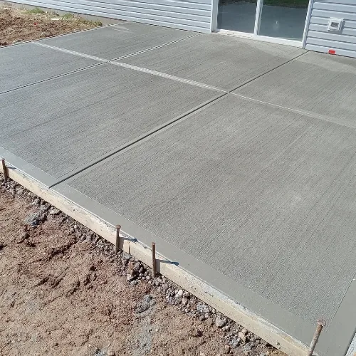 Freshly poured concrete driveway in Sugar Land, TX with clean edging and smooth finish