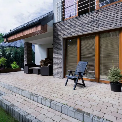 Installing pavers in Houston, TX with compacted base layers for stability