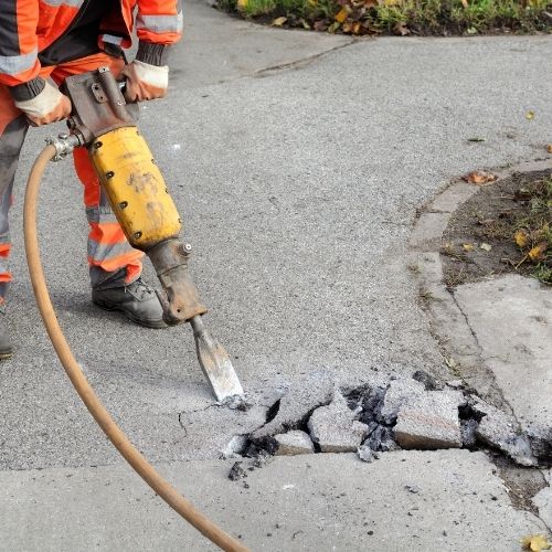 New concrete driveway in front of a home in Fresno, TX