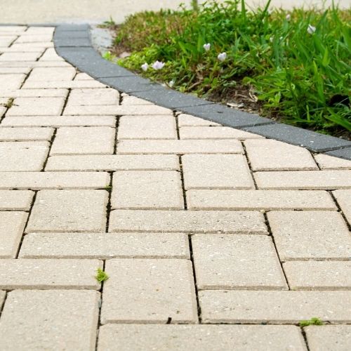 Backyard pavers installation in Sugar Land, TX with custom layout