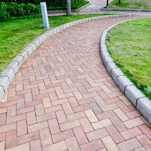 Walkway pavers installation in Sugar Land, TX near a front yard