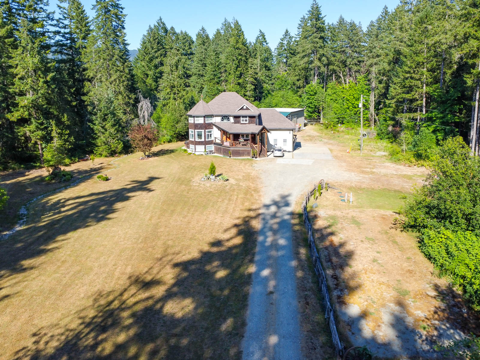 Aerial view showing the acreage and treed setting at 6091 Beaver Creek Road