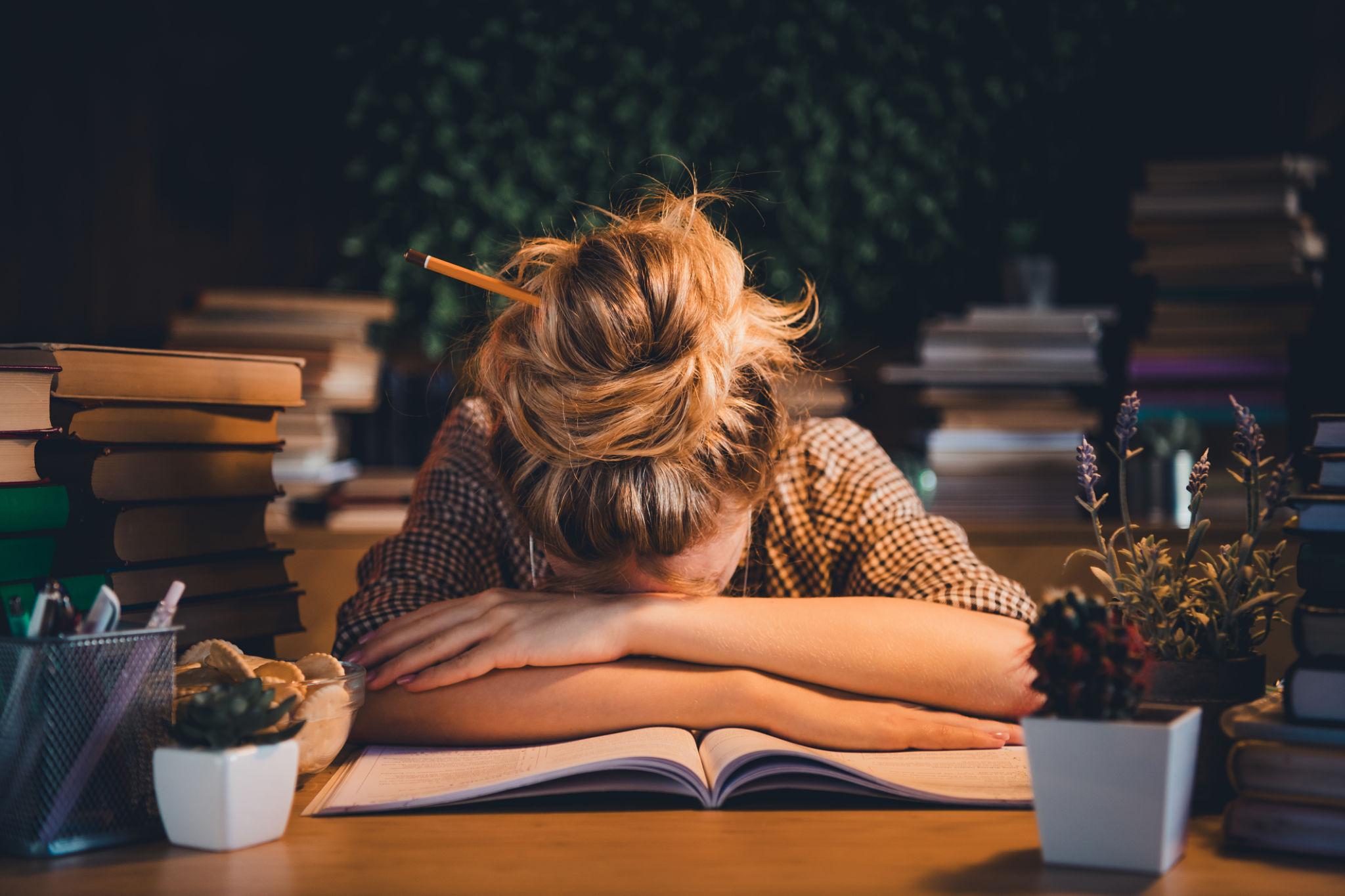 Overwhelmed college student struggling with time management