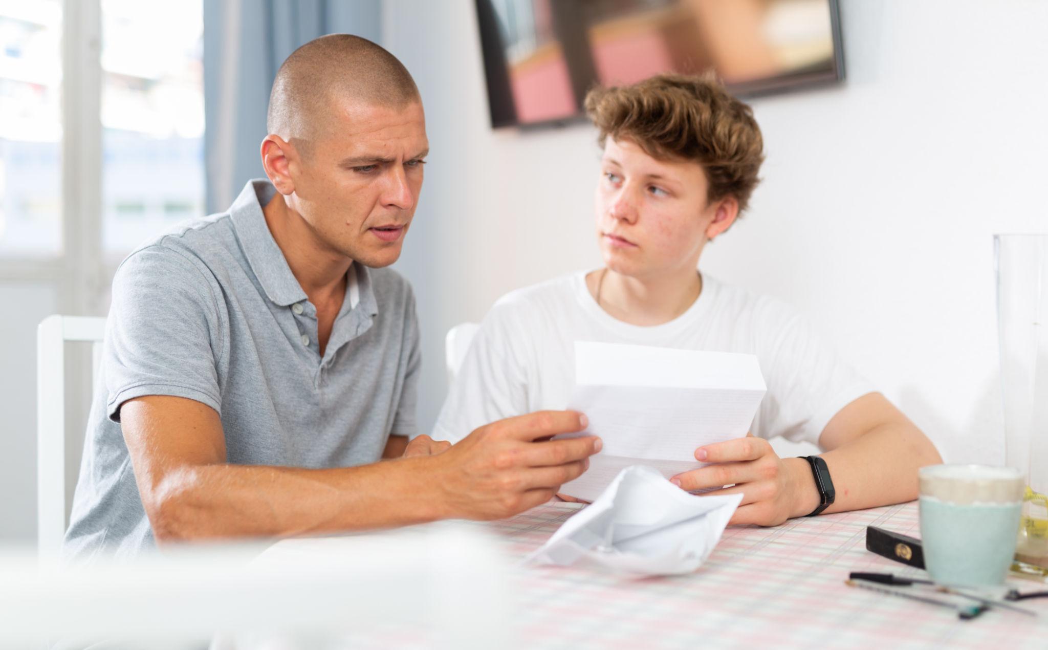 Parent guiding student before leaving for college