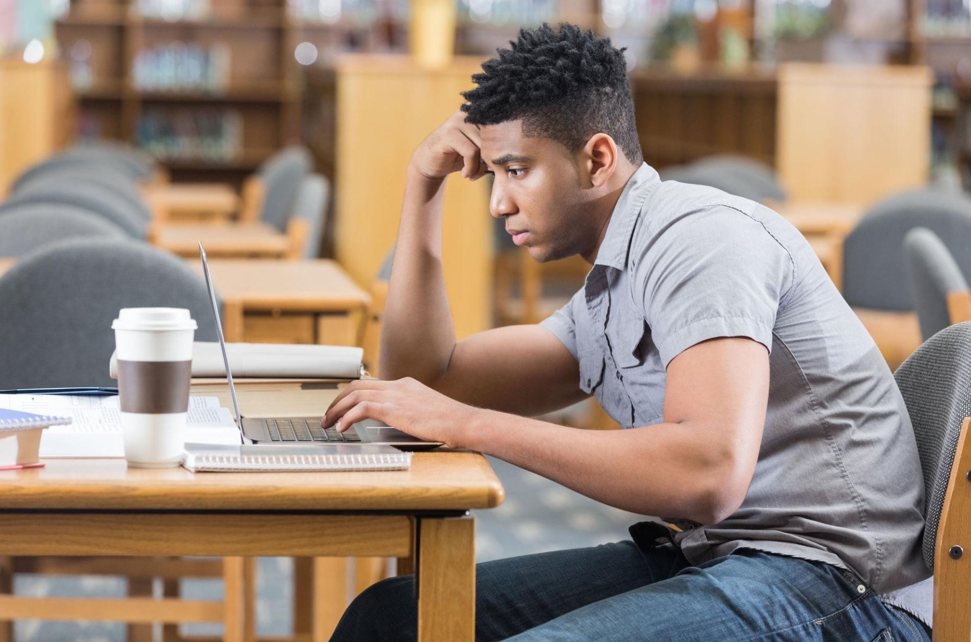 College student experiencing quiet exhaustion while working on an assignment