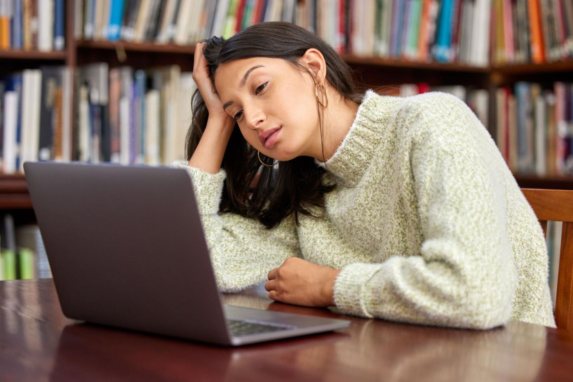 College student experiencing quiet exhaustion while working on an assignment