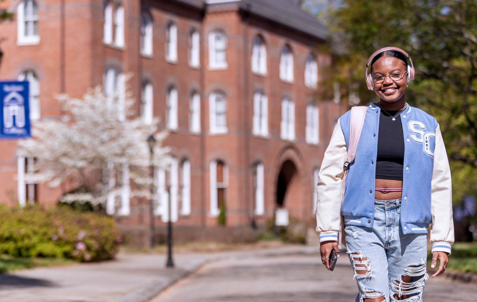 College student taking a restorative break outdoors during the semester