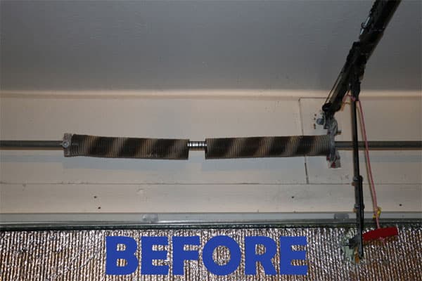 Broken torsion spring above a garage door