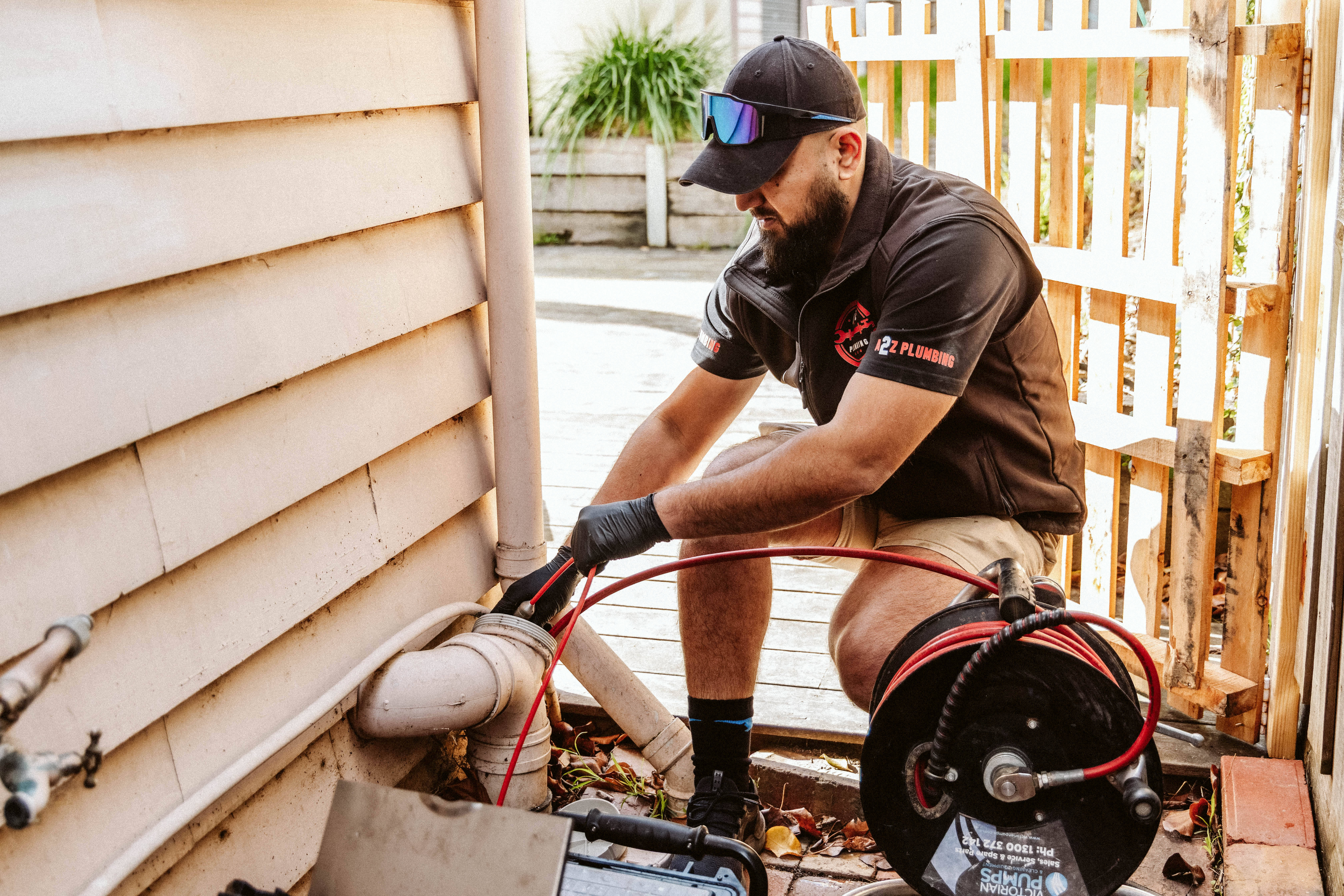 a rusted pipe with a spigot attached to it