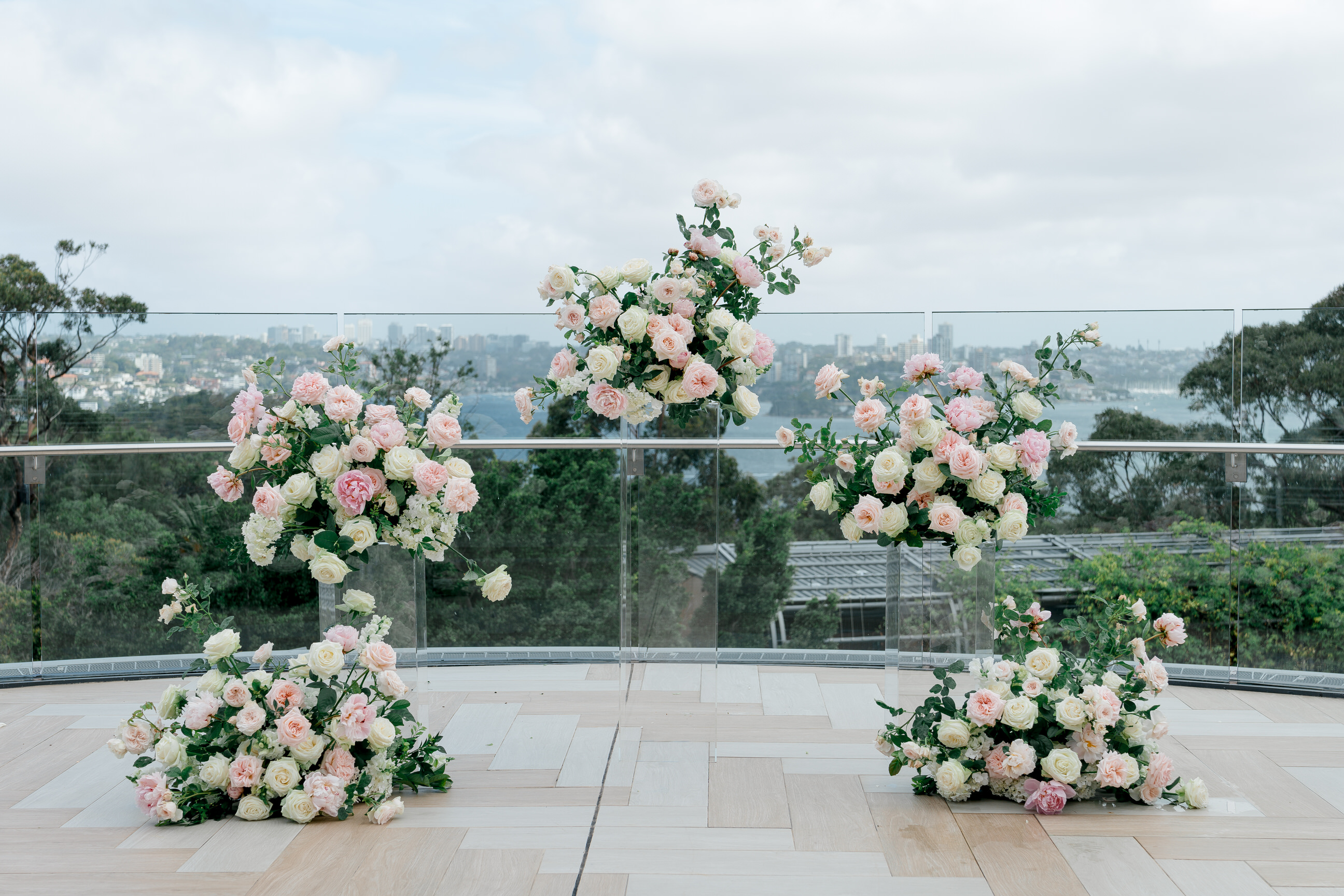Outdoor ceremony florals with a city view
