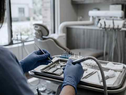 Dentist providing patient care in an independent dental practice