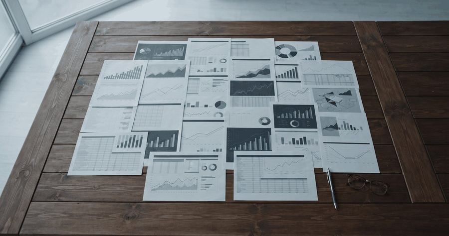 Financial reports spread across a table