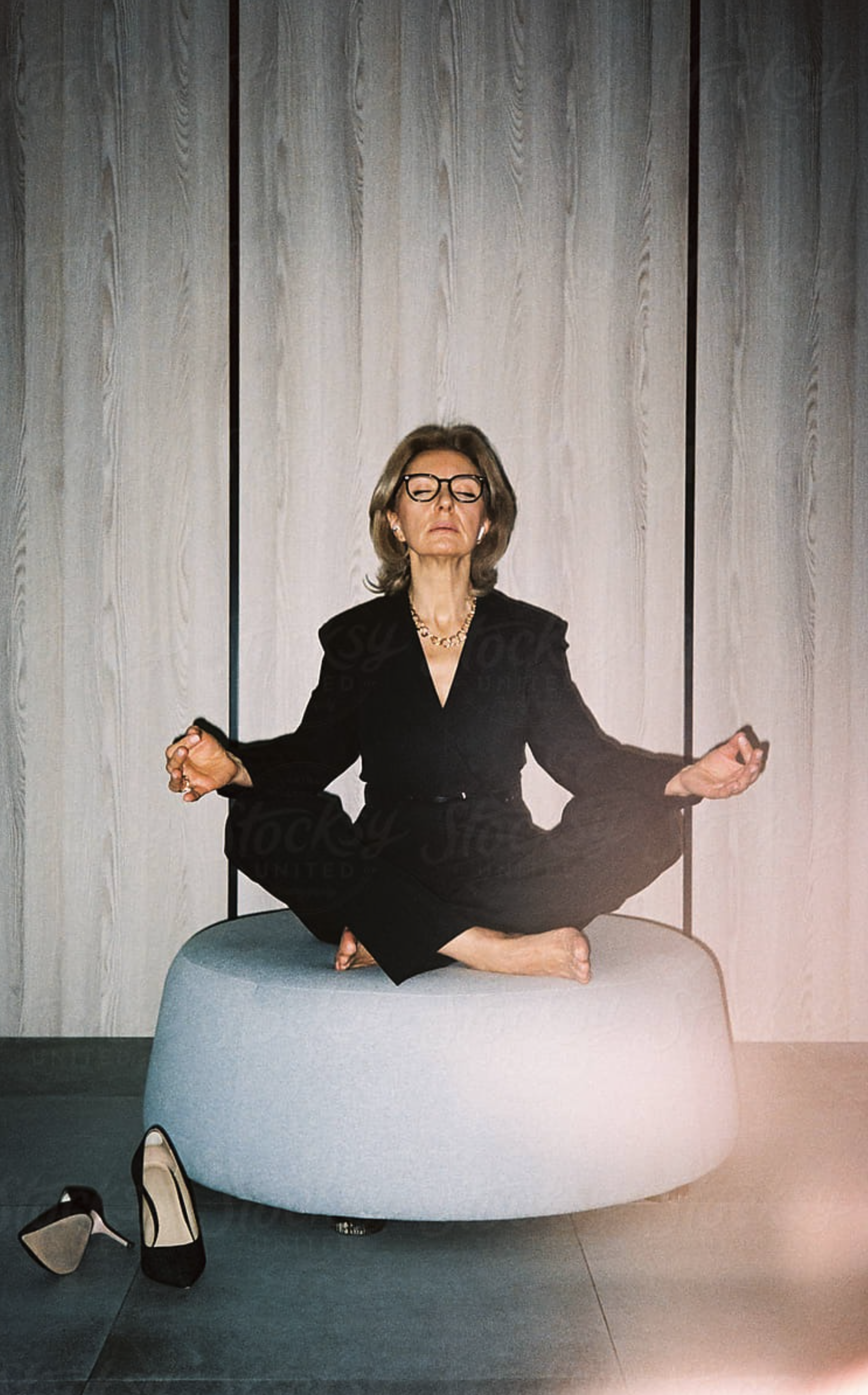 Expert meditating, heels kicked off
