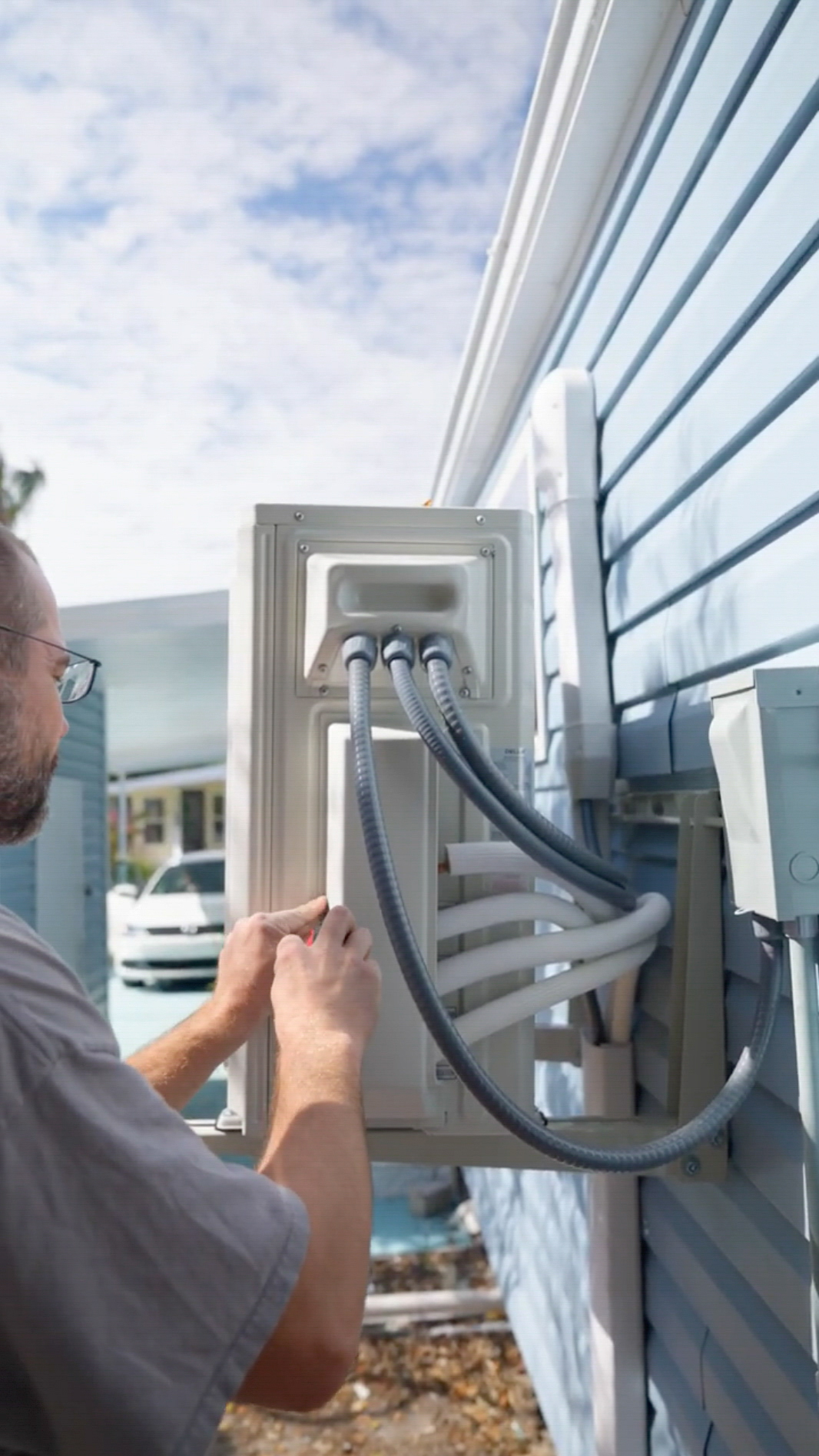 Air conditioning technician servicing AC unit in St. Petersburg