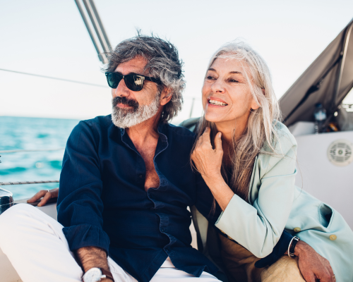 Handsome older couple riding a boat