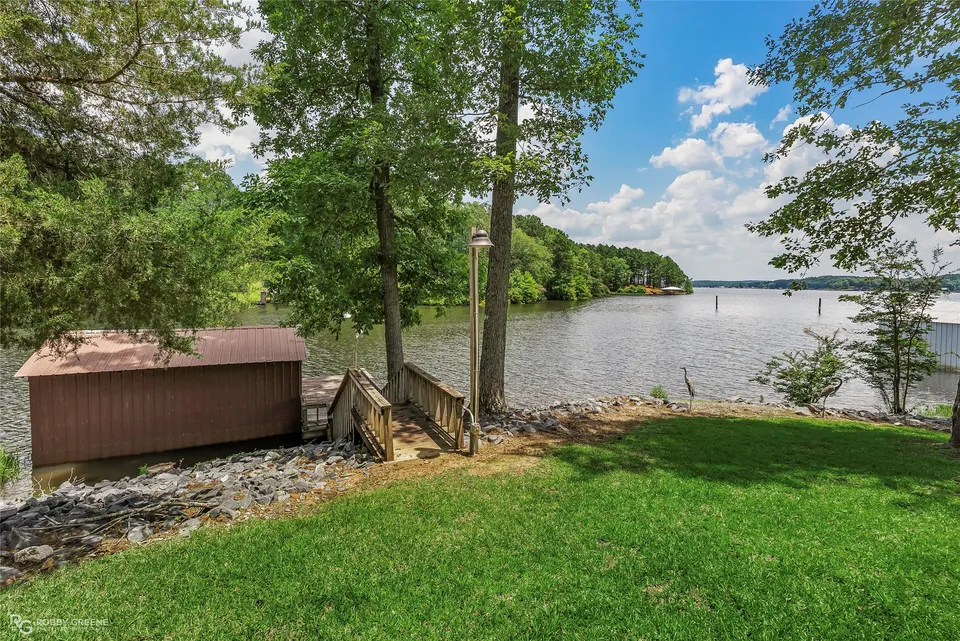 Lakeside lawn, shoreline and boathouse