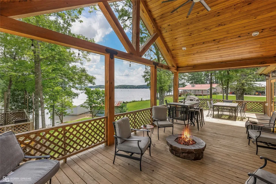 Covered cypress deck overlooking the trees and water at 1072 Featherston Road