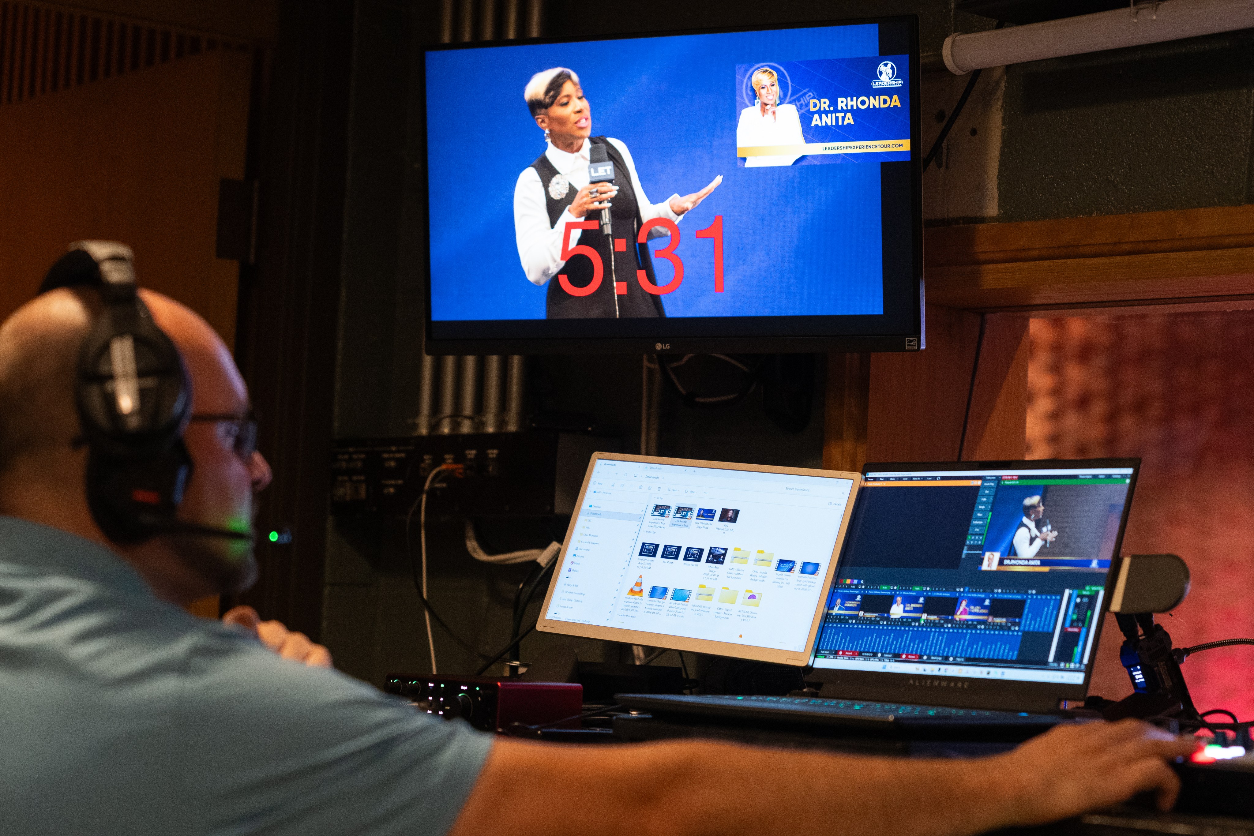 Jeff Schniers on headset at the program position, cutting a live conference broadcast