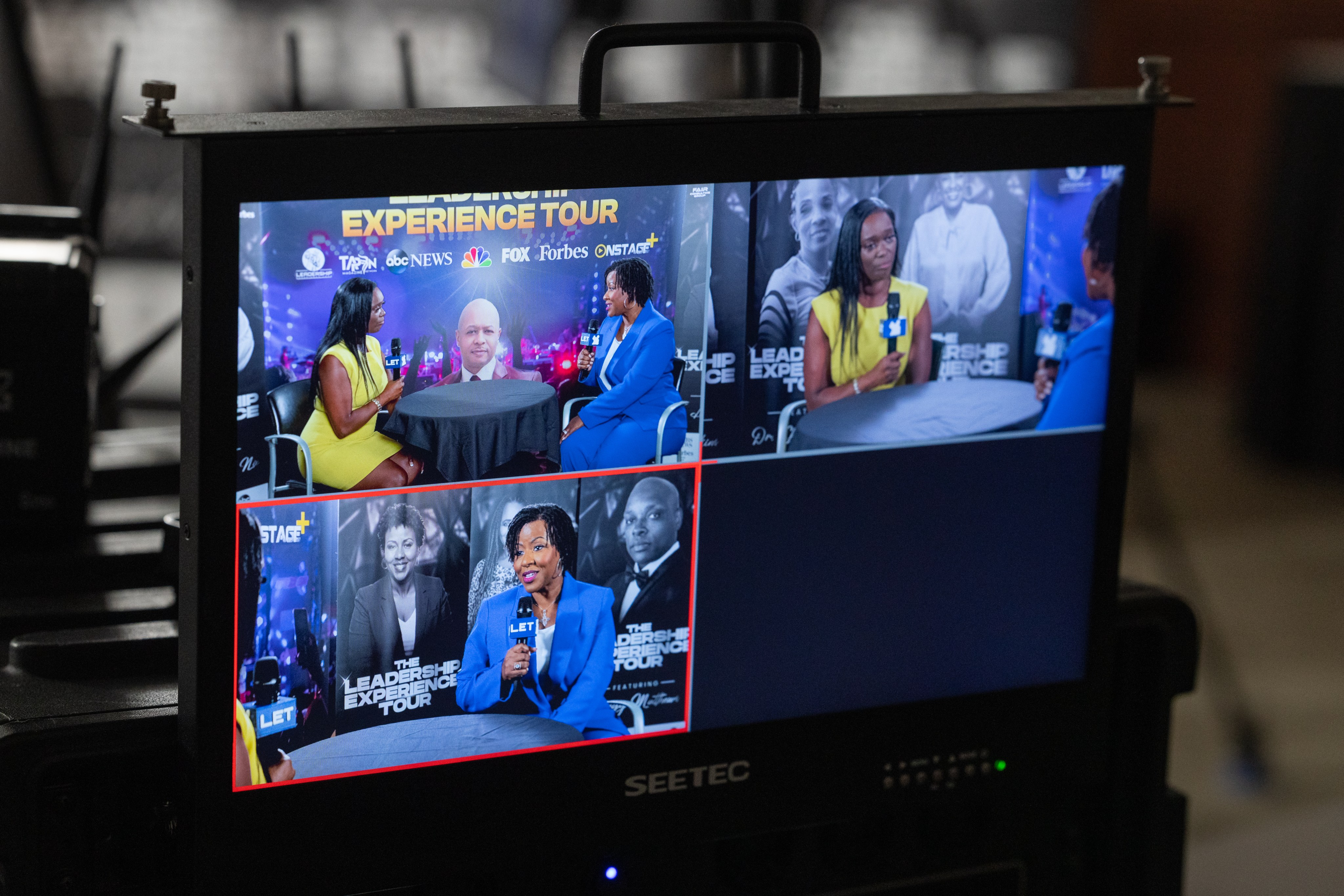 A multiview monitor showing four live camera feeds from a Leadership Experience Tour interview set