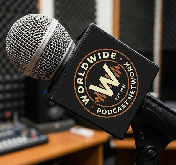 Worldwide Podcast Network logo on a black mic flag in a podcast studio